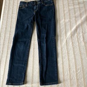 Dark blue jeans with brown stitching